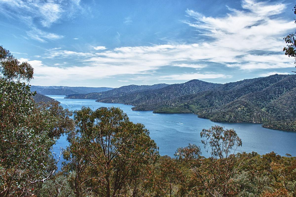 An arm of Lake Eildon winding between steep forested hills in north-east Victoria